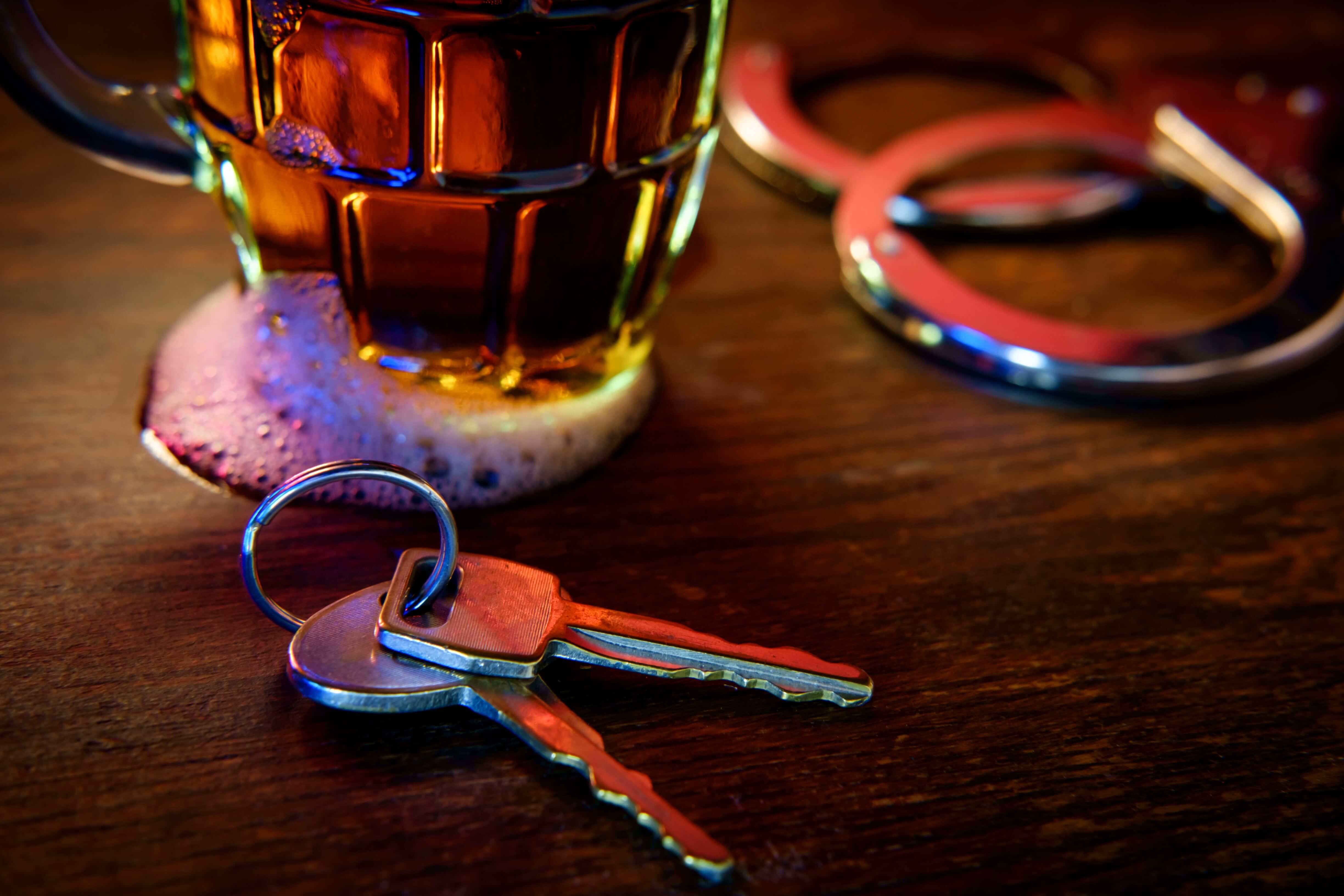 dui first steps symbols: glass of beer with handcuffs and car keys